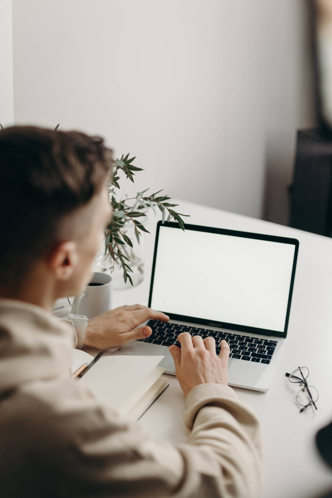 A man using his laptop - darren yaw released